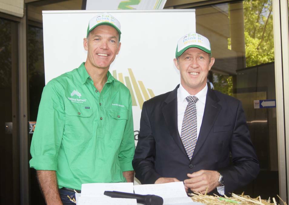 WELCOME NEWS: National Farmers Federation chief executive officer Tony Mahar and Assistant Agriculture and Water Resources Minister Luke Hartsuyker. 