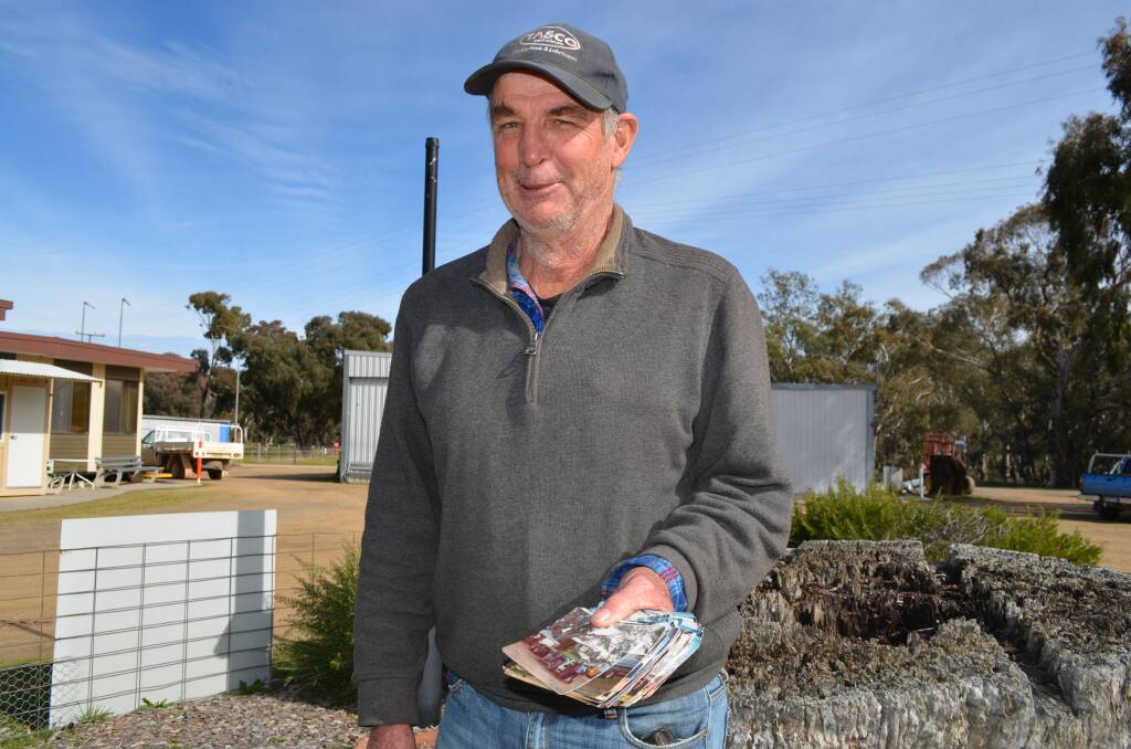PHOTOGRAPHIC KEEPSAKES: Terry Carter of Henty shares his old photo albums that date back to the 1970s. Picture: Nikki Reynolds 