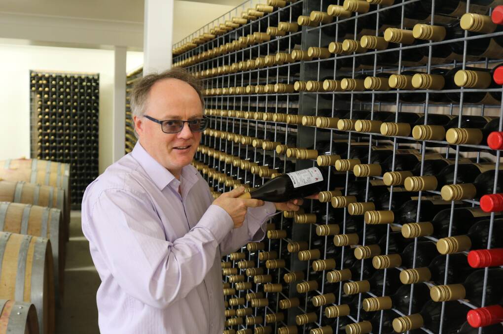 RESEARCH TASK: Professor Leigh Schmidtke inspects bottles of wine. Picture: Supplied