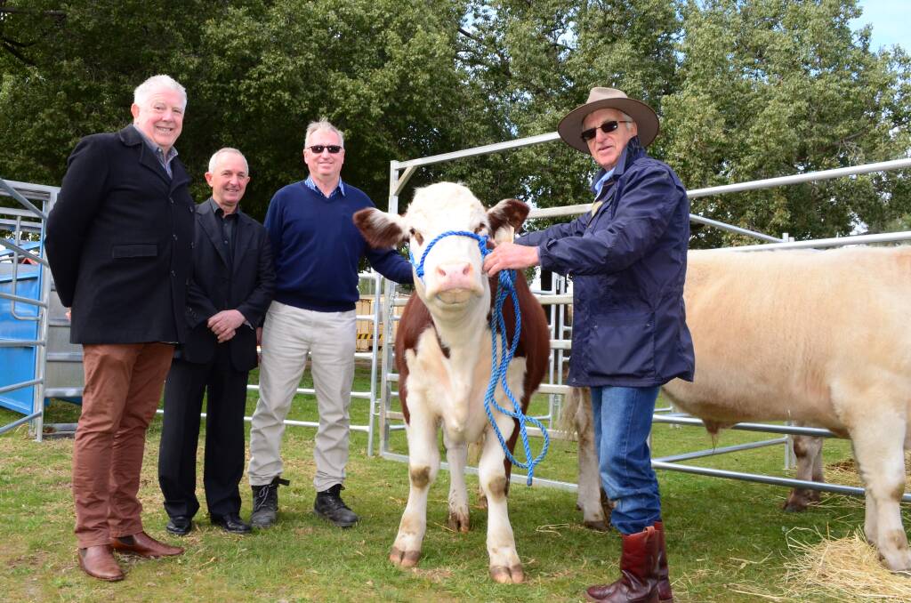 CHARITABLE ACT: Andrew Bell and Peter Thomas of Wagga RSL and Stephen Reynolds who is president of Willans Hill School P&C are pictured with the Hereford charity steer and John Rodd of Wagga. Picture: Nikki Reynolds 