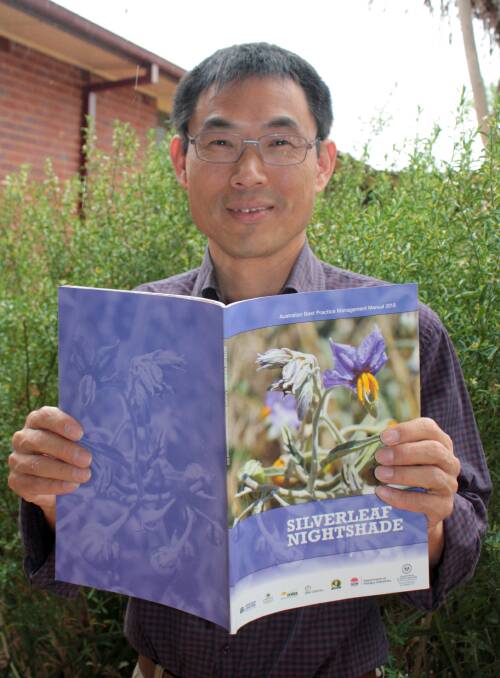 TAKING THE GUESSWORK OUT OF MANAGEMENT: NSW Department of Primary Industries scientist Dr Hanwen Wu with the first national guide to managing one of Australia’s worst weeds, silverleaf nightshade. 