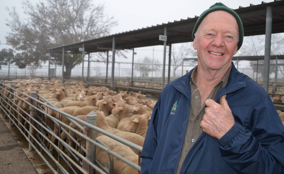 TOP OF THE GAME: Vendor Jeff Hoffman of "Ceranya", Milbrulong sells second cross Poll Dorset lambs at the Wagga sale for $215. Picture: Nikki Reynolds