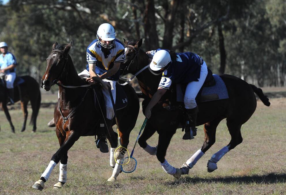CLOSE CALL: Albury pair Matt Davidson and Bec Carter compete during the Wagga polocrosse carnival at Euberta on Sunday. Picture: Laura Hardwick