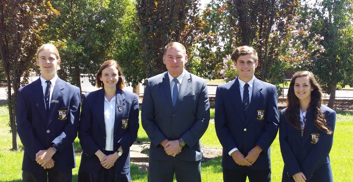ST FRANCIS College principal Seb Spina (centre) with student leaders (from left) Foster Smyth, Jessica O'Halloran, Jameson Booth and Brianna Pilon.