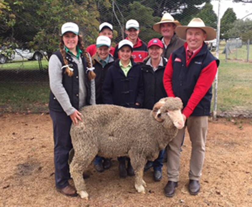 THE top-priced ram purchased by Jim and Clare Buckley, Jindabyne with Tim Schofield Elders Cooma (right), and Lachlan, James, Elle, Miranda and Ivy McGufficke.