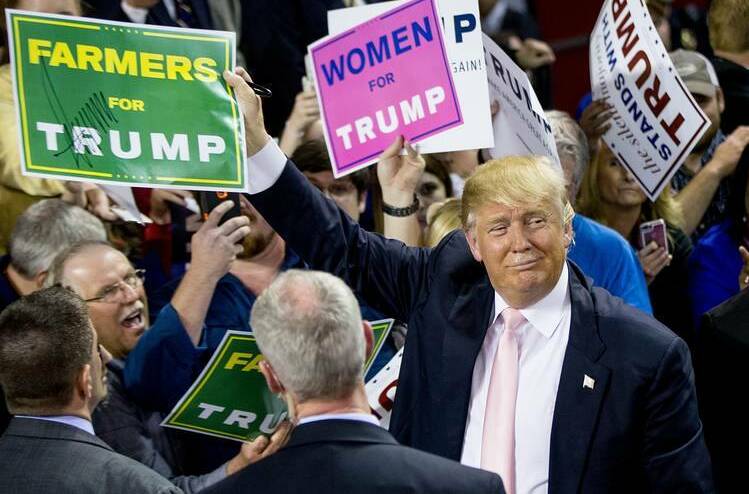 Donald Trump holding a "Farmers for Trump" sign during the USpresidential election campaign.
* Picture supplied Farmers for Trump Facebook page. 