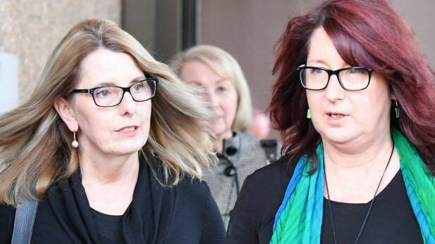 Alison McKenzie (left), widow of Glen Turner, with Glen's sister Fran Pearce, leave court after the sentencing of his murderer Ian Turnbull in June 2016. Photo: Peter Rae