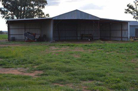 The large steel machinery shed is just one of the many improvements on this large property located just 21 kilometers from Grenfell.