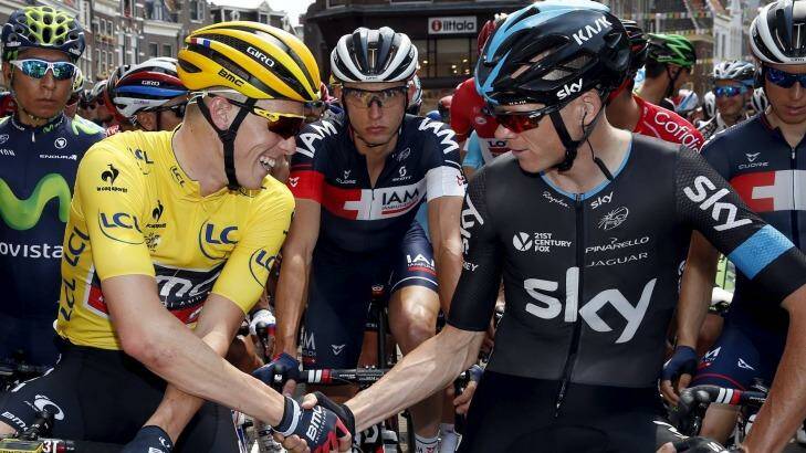 BMC's Australian rider Rohan Dennis shakes hands with Team Sky leader Chris Froome before the start of stage 2 in Utrecht. Photo: Benoit Tessier 