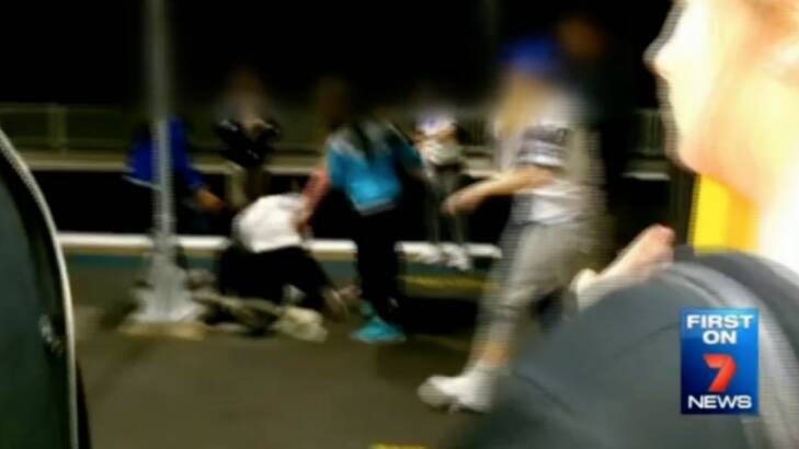 The brawl between a group of teenage girls, which started on a train, spills out onto a platform.