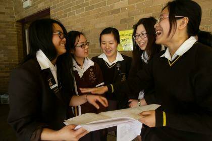 Relieved: Sydney Girls' HSC students Vicki Zhong,  Jessica Nguyen, Alisa Zheng, Vivian Tang and Mary (Zhou) Chen relax after their maths exam. Photo: Dallas Kilponen