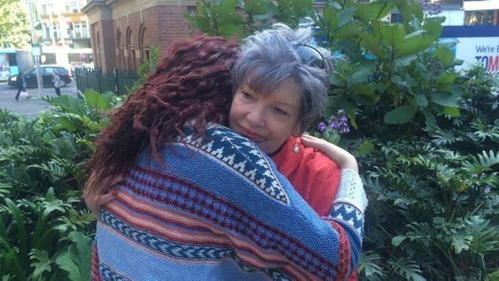 Karen Lindley from child protection agency Bravehearts hugs the victim after rapist Thomas Hofer was sentenced to jail. Photo: Emma Partridge 