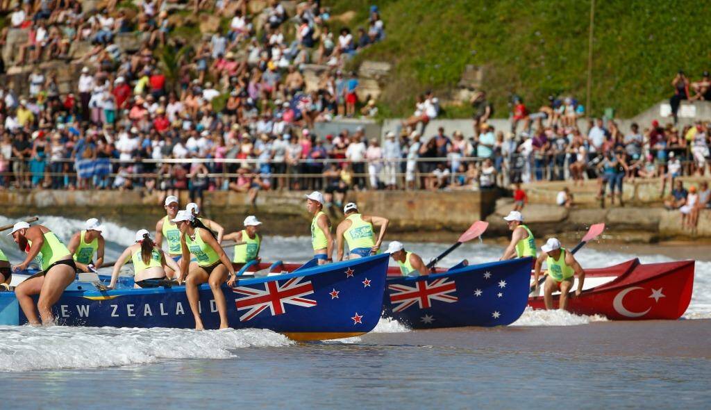 Surf boats  in New Zealand, Australia and Turkish colours  arrive to Collaroy beach. Photo: Daniel Munoz