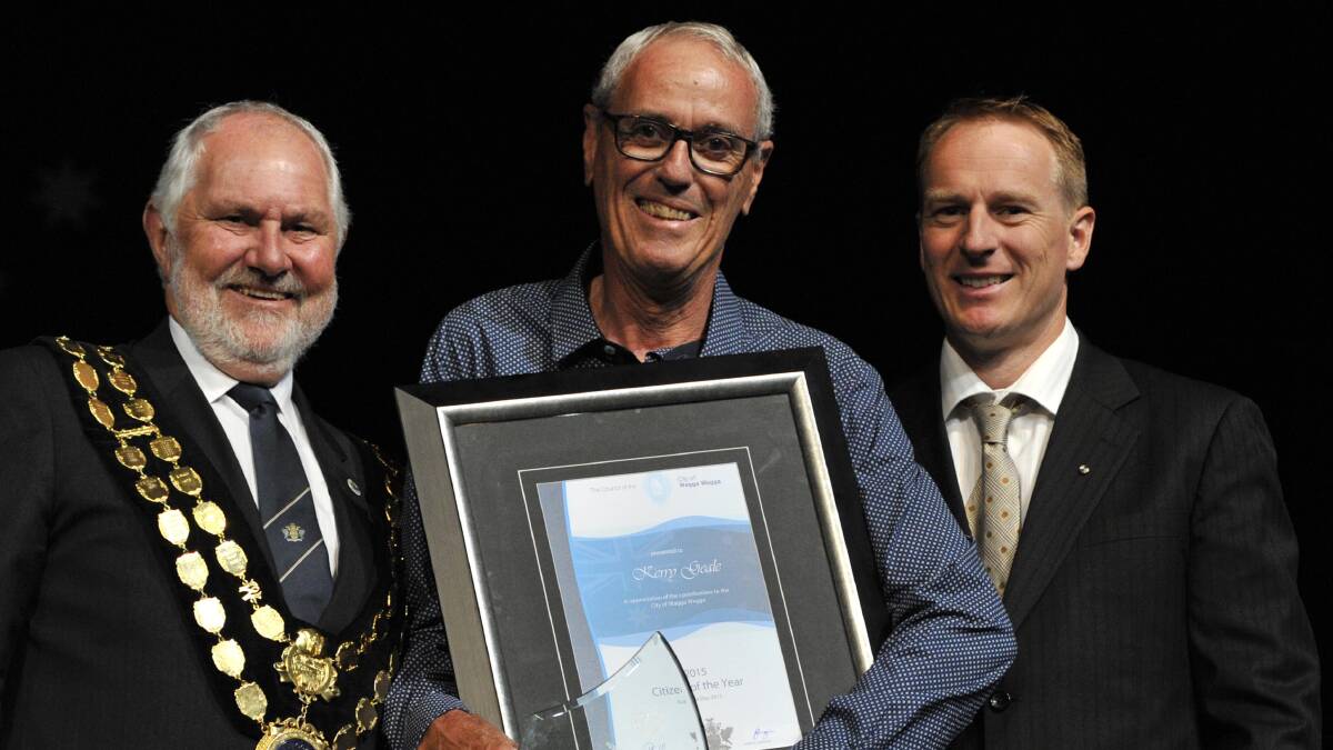 Kerry Geale, pictured with mayor Rod Kendall and Australia Day ambassador Damian Candusso, was named Wagga's citizen of the year at the 2015 Australia Day awards ceremony. Picture: Les Smith