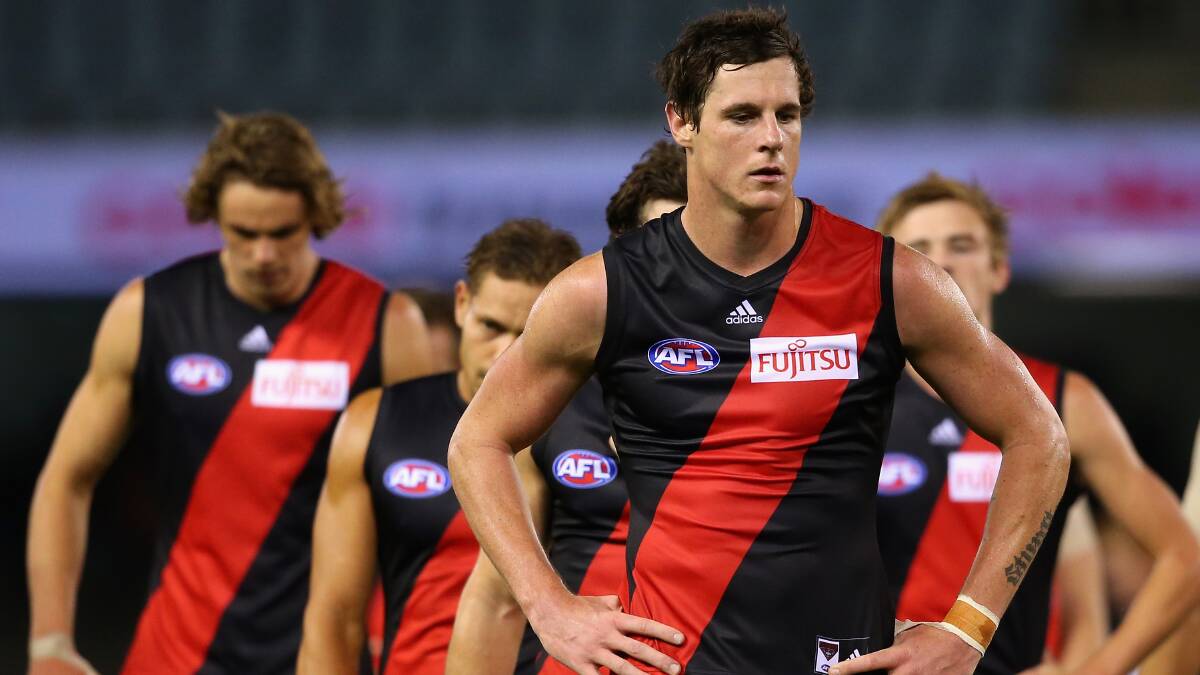  The Bombers look dejected after losing the round five AFL match between the Essendon Bombers and the St Kilda Saints at Etihad Stadium on April 19, 2014 in Melbourne, Australia. Photo: Quinn Rooney/Getty Images.