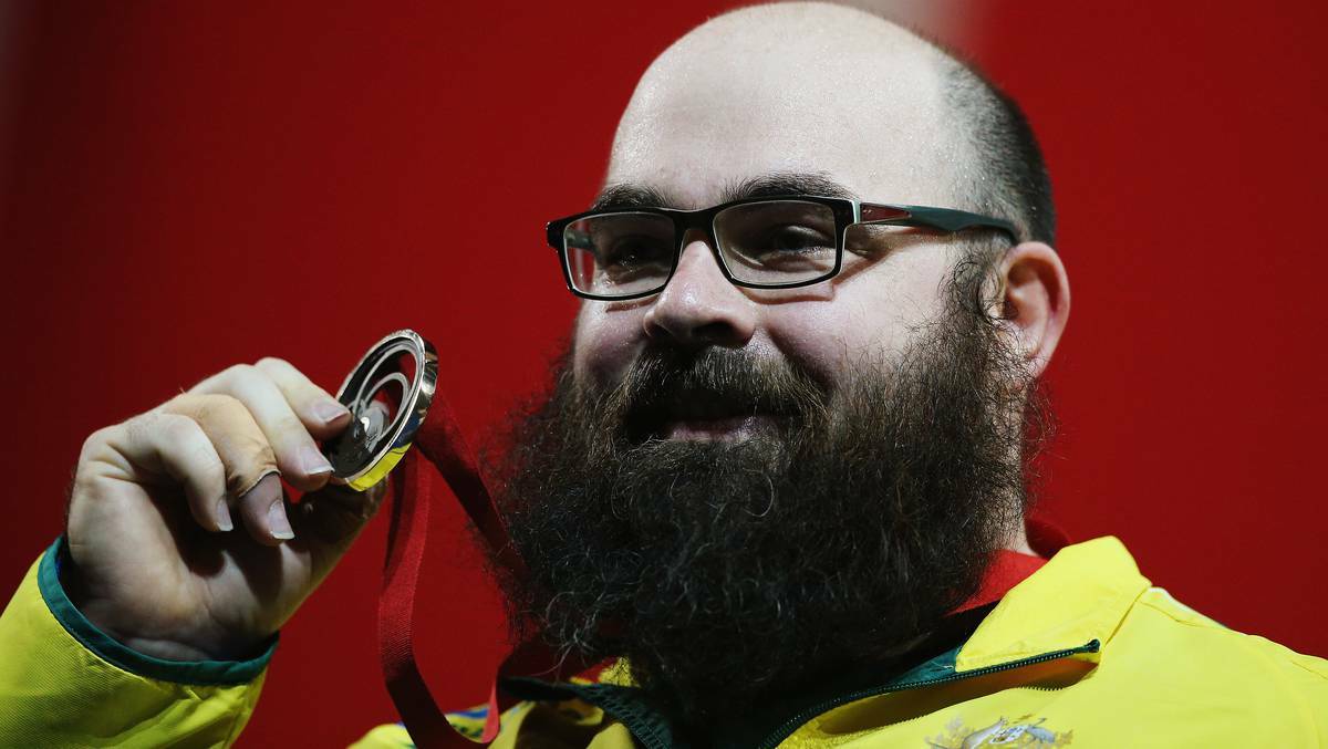 Queensland's colossus Damon Kelly, the man with the most fearsome beard in the Commonwealth Games Village, overcome a year of injuries to take home bronze in the superheavyweight competition. Photo: Getty Images