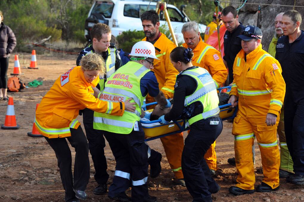 ACTION: Dramatic rescue unfolds at Mt Arapiles. A Man, 24, trapped while negotiating the Mt Arapiles squeeze test. Pictures: PAUL CARRACHER
