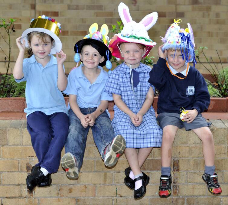 Isabel Duncan, 6, Dylan Metz, 5, Mia Reid, 5, and Liam Griffiths, 5, at the Ashmont Public School Easter hat parade. Picture: Kieren L Tilly