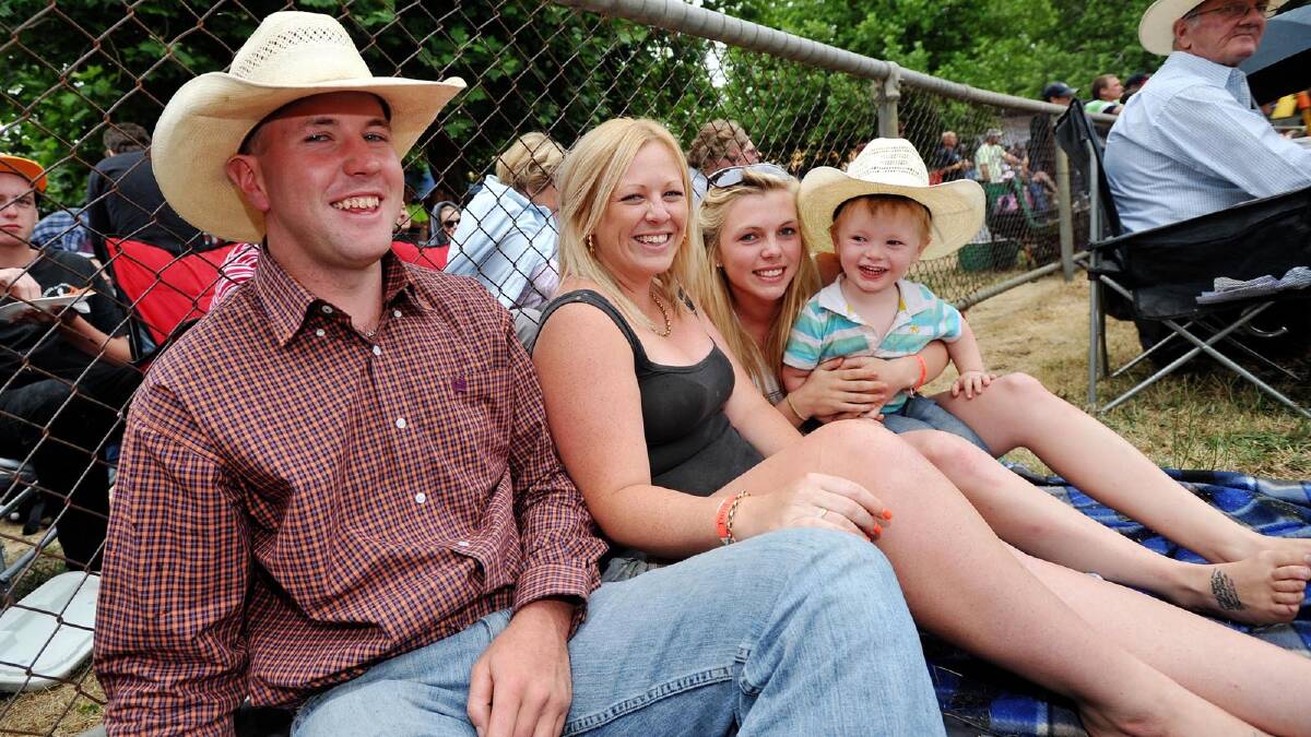 Rusty McKay, Bree Brown, Brittany Waters and Noah Waters, 2, at the Tumbarumba Rodeo on New Year's Day. Picture: Alastair Brook