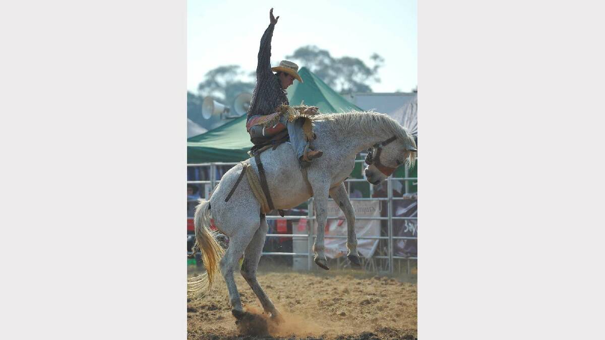 COOLAMON RODEO: Lincoln Smith gets an arm up in the second division bronc ride. Picture: Addison Hamilton