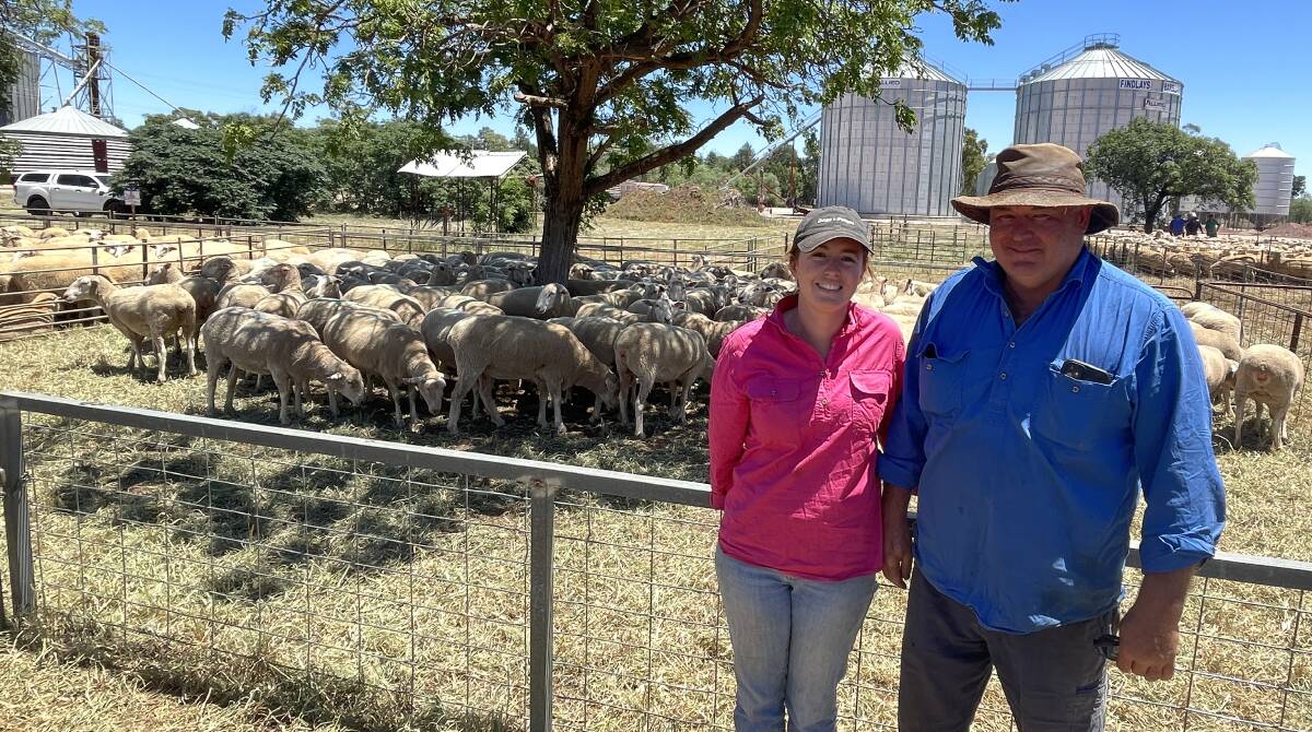 Grace and Keith Fixter with their pen of scanned-in-lamb ewes sold for $340. Picture by Alexandra Bernard.