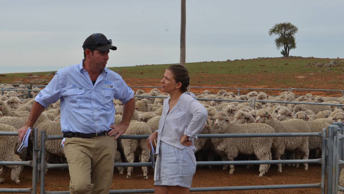 Sponsor Tom Corkhill, Corkhills Ag Service, Boorowa discussing the state of the wool industry with Toyha Johnson.