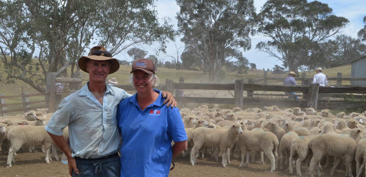 George and Libby Elliot with their pen of second-cross lambs which sold for $136.