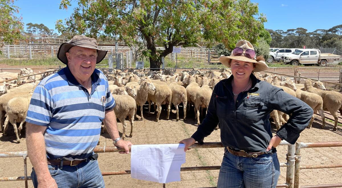 Peter Wood, Yalgogrin North, and Emma Northey, Quade Moncrieff Livestock and Property, West Wyalong, with the pen of first-cross ewes that sold for $395 a head. 