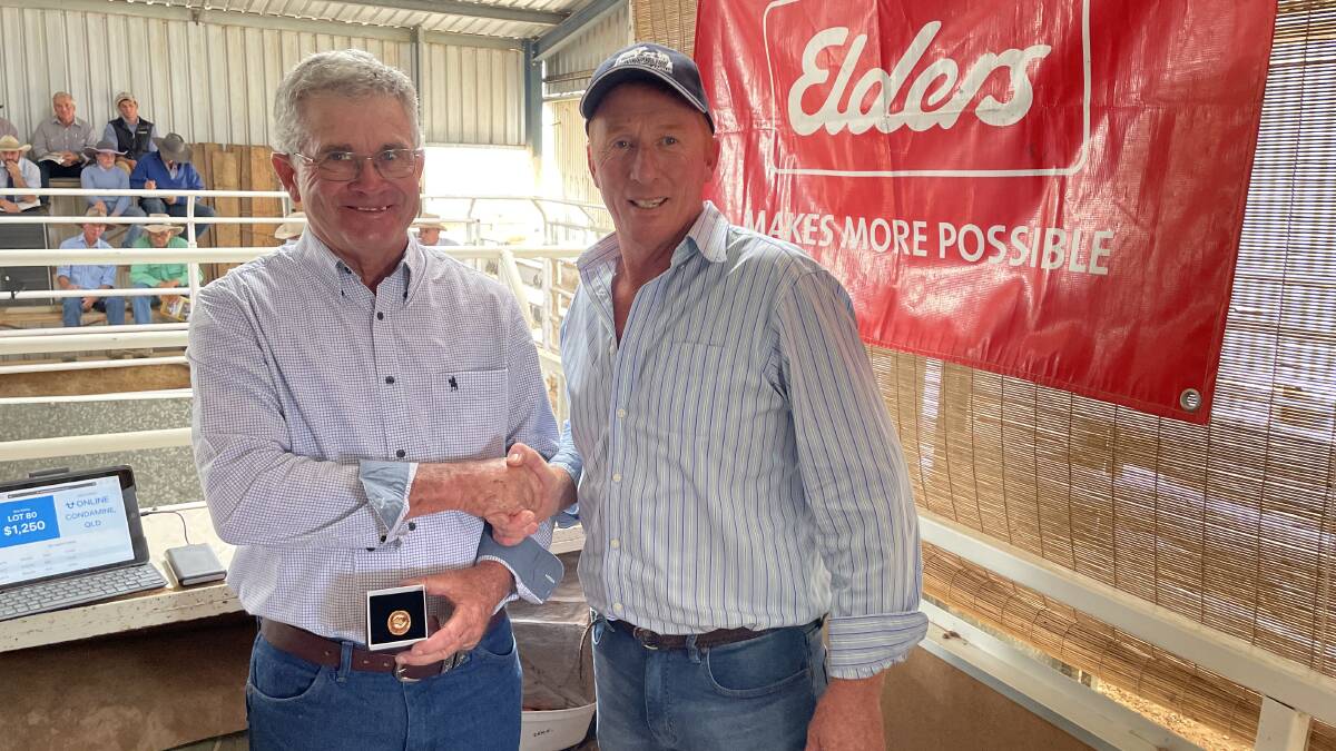 Gerald Spry of Spry's Shorthorns receiving life membership from Chris Thompson, Bayview Shorthorns, Yorketown, SA. 