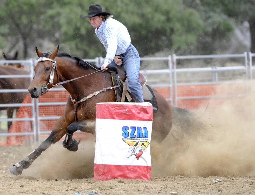 AGAINST THE CLOCK: Michelle Bush of Yass competes in the barrel race at the Tarcutta Rodeo. 