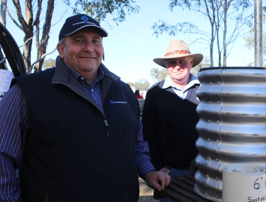 WORKING DISPLAY: Andrew Choake of Franklin Electric and Bob McCormack of Winchendonvale demonstrate the Air Well pumps at Henty.
