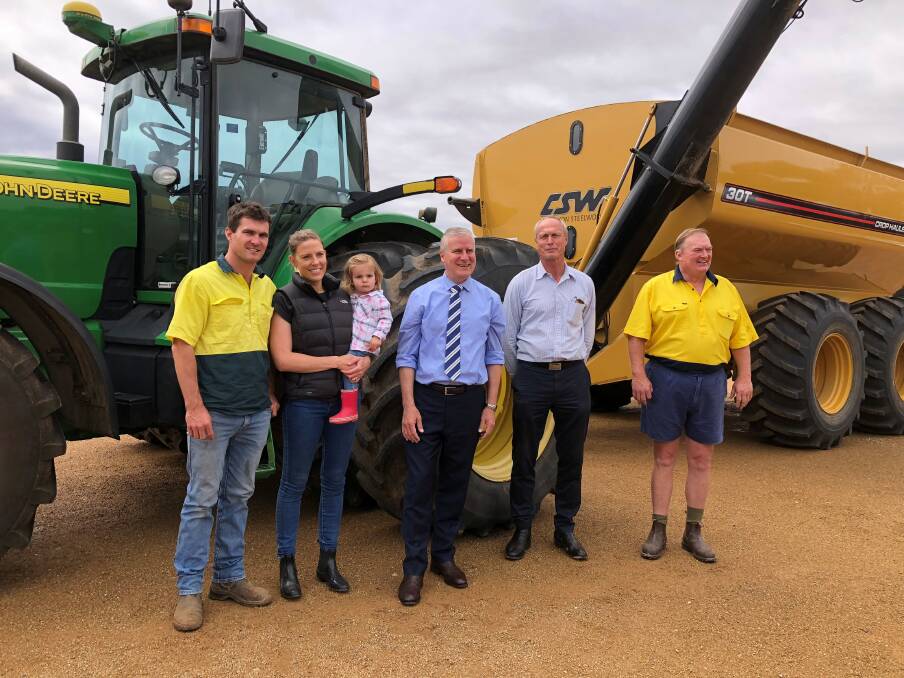 AT THE WHEEL: Tom and Jemma Yates with daughter Martha, 2, acting prime minister Michael McCormack, Derek Schoen of NFF and Peter Yates, Yerong Creek. 