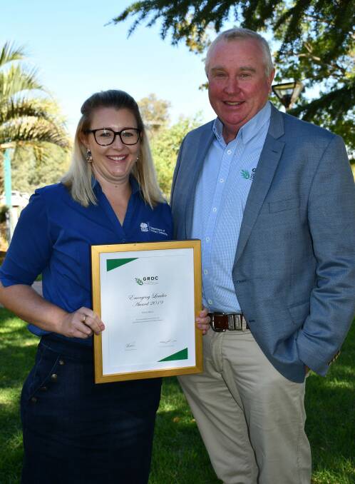 AWARD: NSW DPI crop physiologist Felicity Harris is presented with the GRDC emerging leader award by GRDC northern region panel chairman John Minogue.