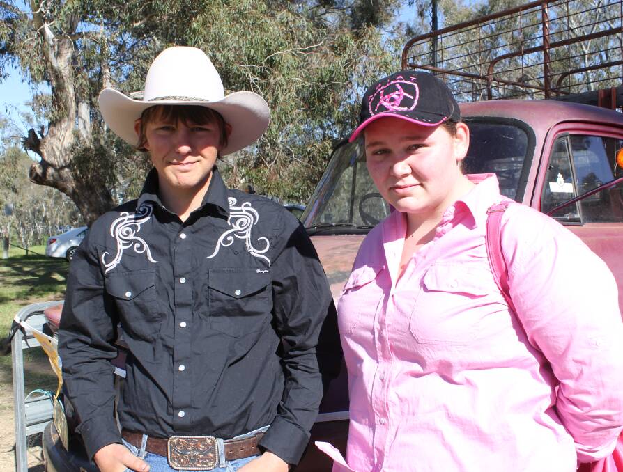 DAY OUT: Jordan Tyler and his sister Hannah Tyler of Tarcutta watch the action at the yard dog competition at Henty.