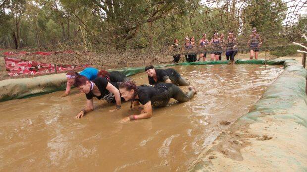 TESTED ON COURSE: Participants in Miss Muddy show their skills and fitness. Picture: Canberra Times 