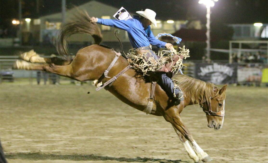 PERFECT FORM: Tooma cowboy Brad Pierce wins the Australian Professional Rodeo Association saddle bronc title at Warwick. Picture: French's Photos