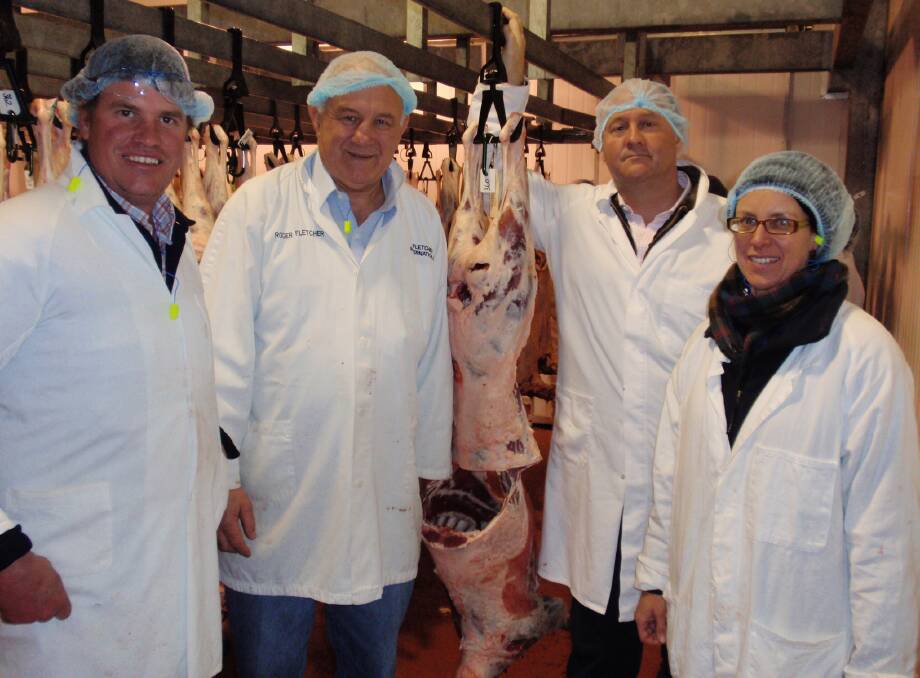 ASSESSMENT: Craig Wilson, Roger Fletcher, Sally Martin and Stuart McCulloch assess lamb carcases. 