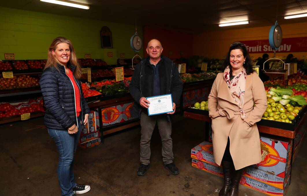 APPRECIATION: Toni Nugent (left) and Mardi Walker (right) are pictured with Robert Papasidero of Wagga Fruit Supply, Bardo Lane. Picture: Emma Hillier