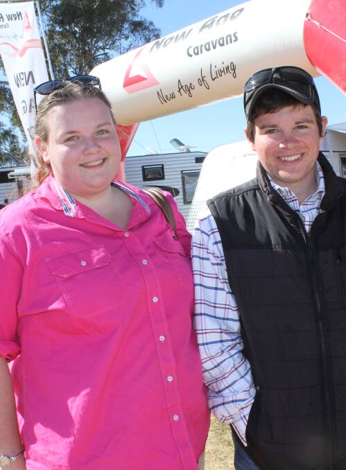 WALKING THE SITE: Lachlan Hohnberg, and Kimberley Gilbert, both of Wagga, visit the exhibits at the 2015 Henty Machinery Field Days.
