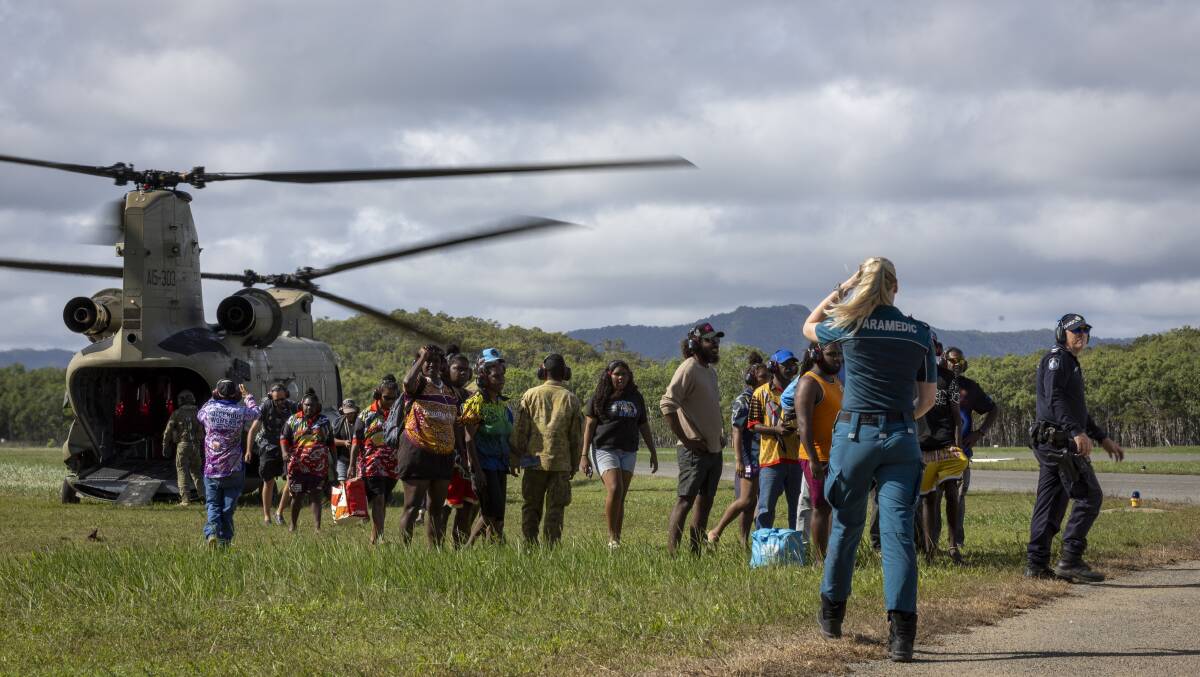 Australian Army personnel, Queensland Police and emergency services help residents to evacuate from Wujal Wujal to Cooktown via CH-47F Chinook helicopter. Picture Defence Media