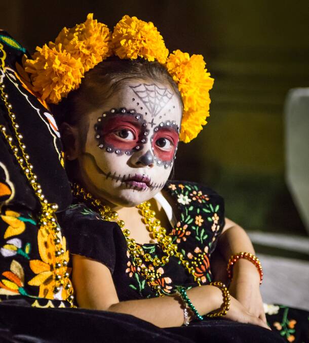 Tradition: As part of the Day of the Dead celebrations people of all ages have their faces artfully painted to resemble skulls, and they don suits and fancy dresses.