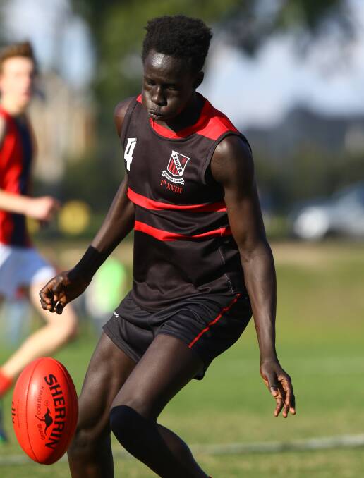 XAVIER College boarder Changkuoth "CJ" Jiath has been drafted by Hawthorn Football Club as a rookie.