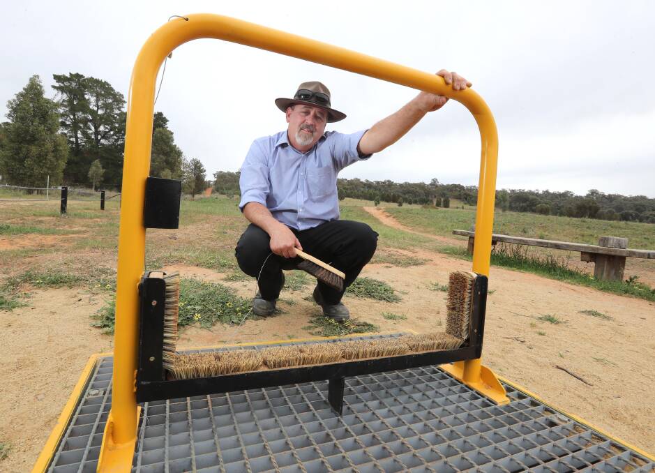 WEED KILLER: Tony Phelps unveils the weed hygiene station in Pomingalarna Reserve. Picture: Emma Hillier