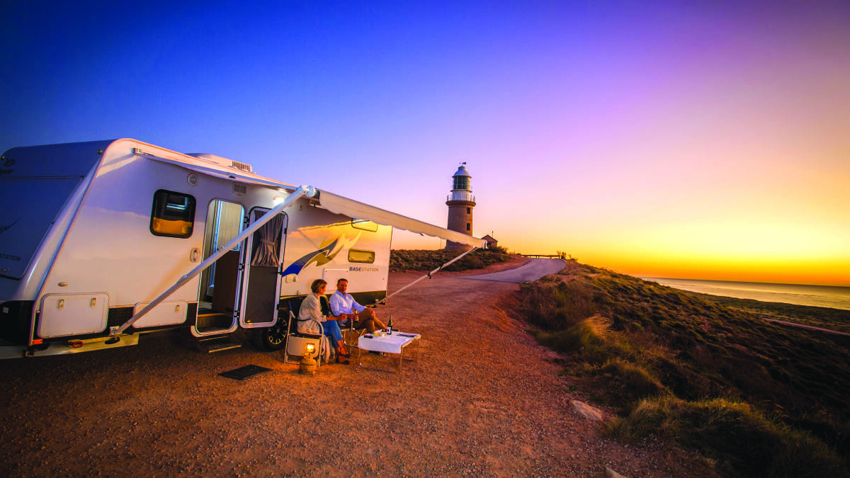 Couple with Caravan at sunset at Vlamingh Head Lighthouse
