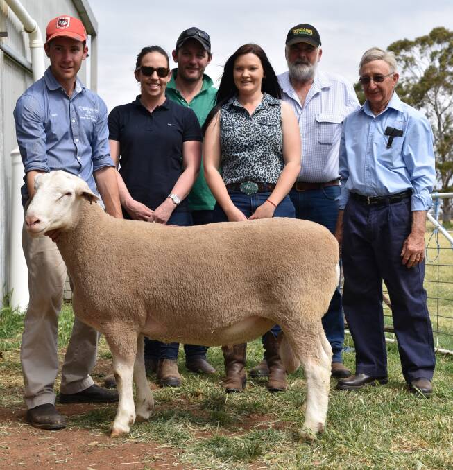 Mark Dissegna, Amanda and Finlay MacDonald, Caitlin and Clive Shillabeer and Amando Dissegna with top selling ram Tw160032 which sold for $21,000 on Wednesday at Warburn White Suffolk stud.