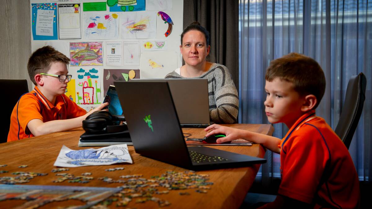 Jayne Trustum with her sons Tyler, 10, and Hunter, 7, said the family had found learning and working remotely difficult. Picture: Elesa Kurtz