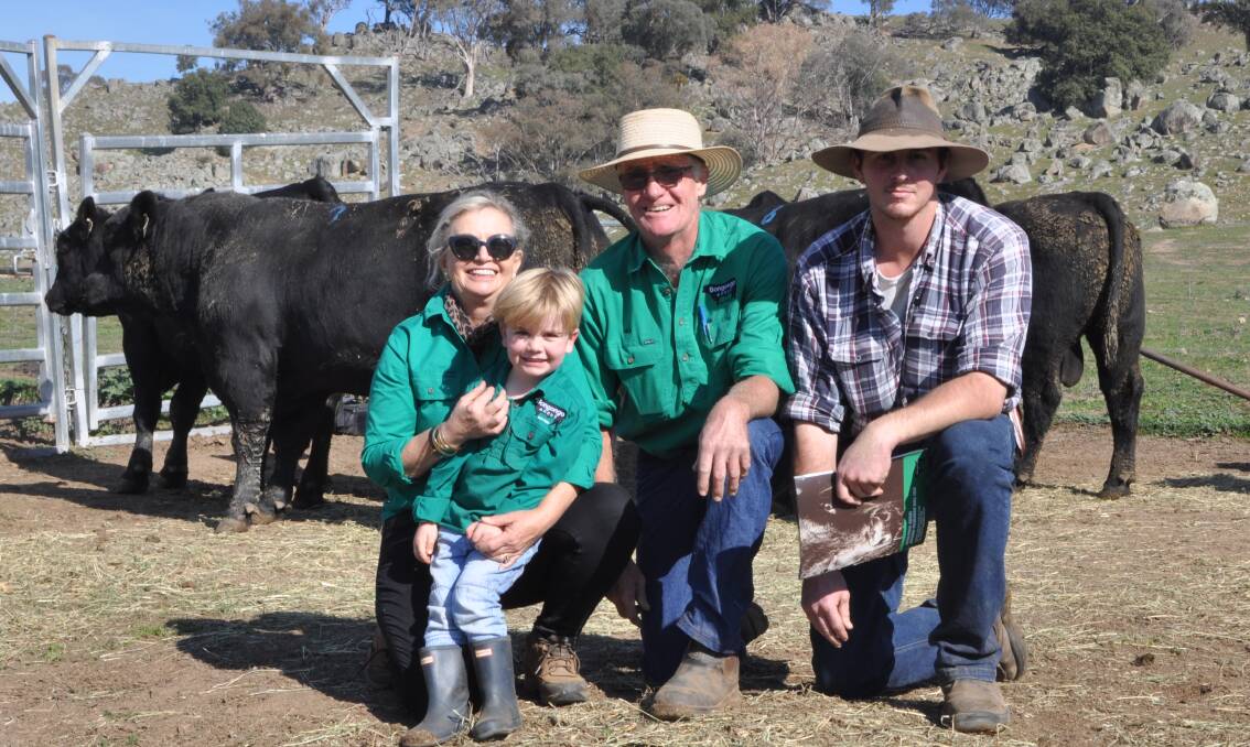 Shauna and Bill Graham of Bongongo Angus, Coolac with grandson Teddy Murphy and Sean McMullen of Boambolo Pty Ltd, Yass who bought two of the top priced bulls for $11,000 each. 