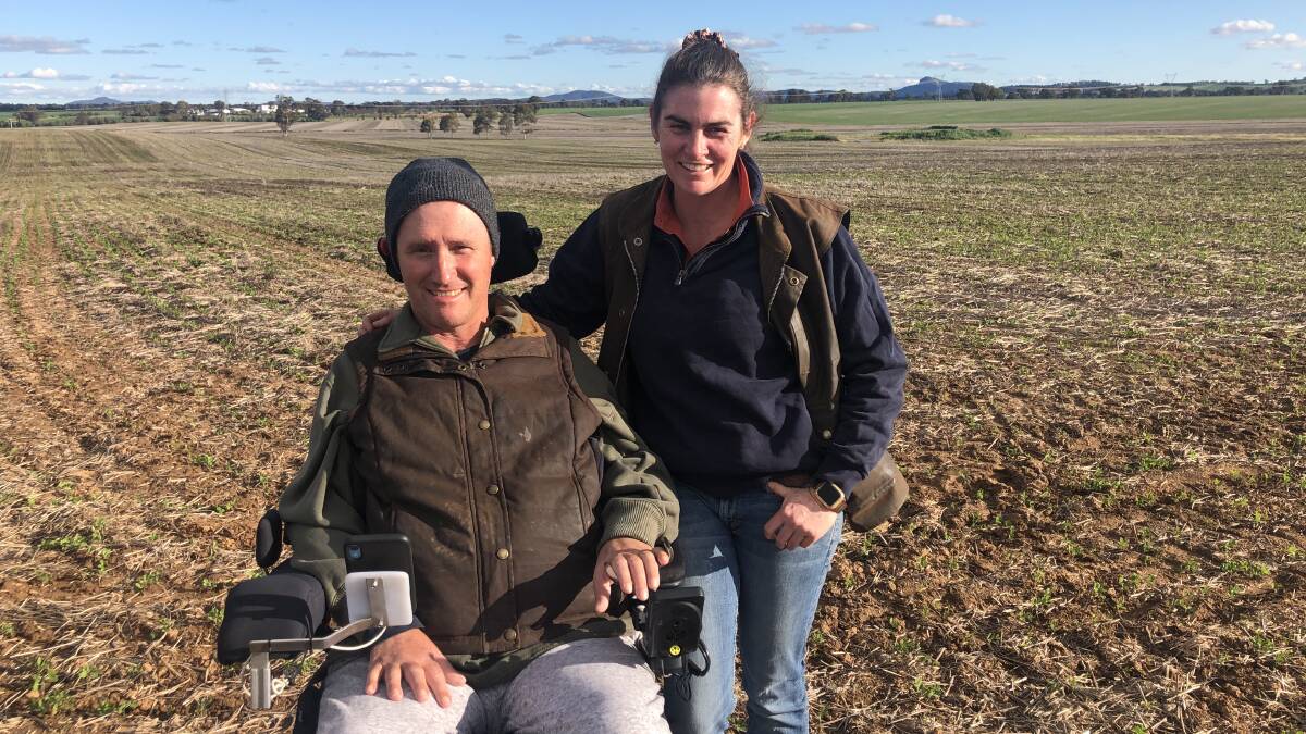Derek and Skye Lewington, Uranquinty, with their field peas that have just emerged after a May 25 sowing date. The field peas are part of their four-year rotation and offer moisture retention, nitrogen fixation and weed control. 