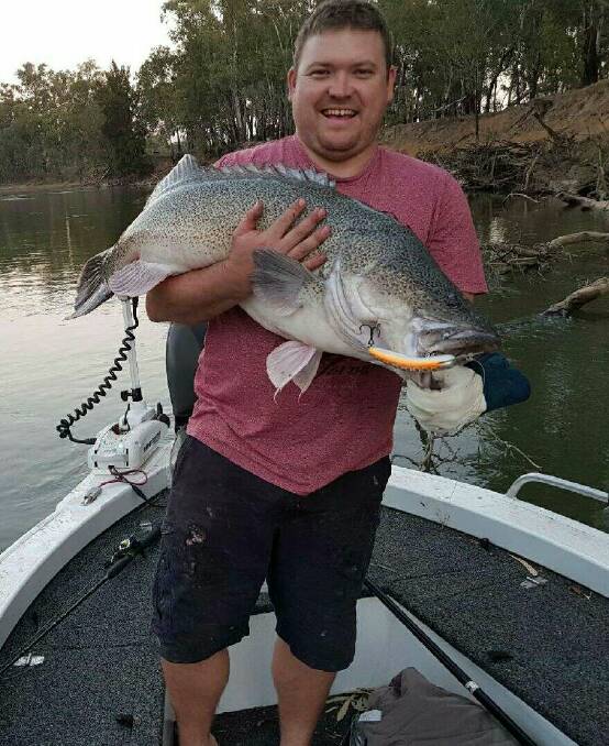 HAPPY DAYS: Fishing fan Craig with a metrey caught in the river near Narrandera.  You can send your pictures to craig@waggamarine.com.au or 0419 493 313. 