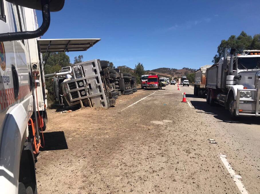 Cattle truck rolled over on the Hume Highway. Picture: Jessica McLaughlin 